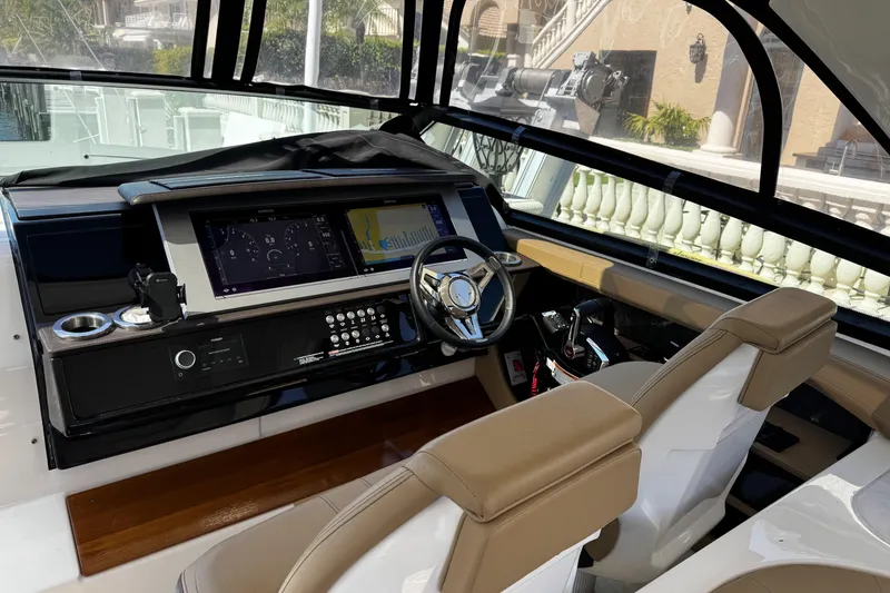 Slide: The Image of 2023 Sea Ray SLX 400 helm with modern controls and dual displays. - 24