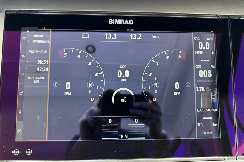 Slide: The Image of Simrad display on 2023 Sea Ray SLX 400 showing engine metrics and navigation data. - 3