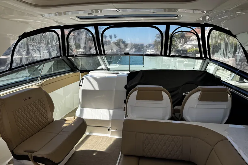 Slide: The Image of Interior of 2023 Sea Ray SLX 400 boat with luxurious seating and panoramic windows. - 30