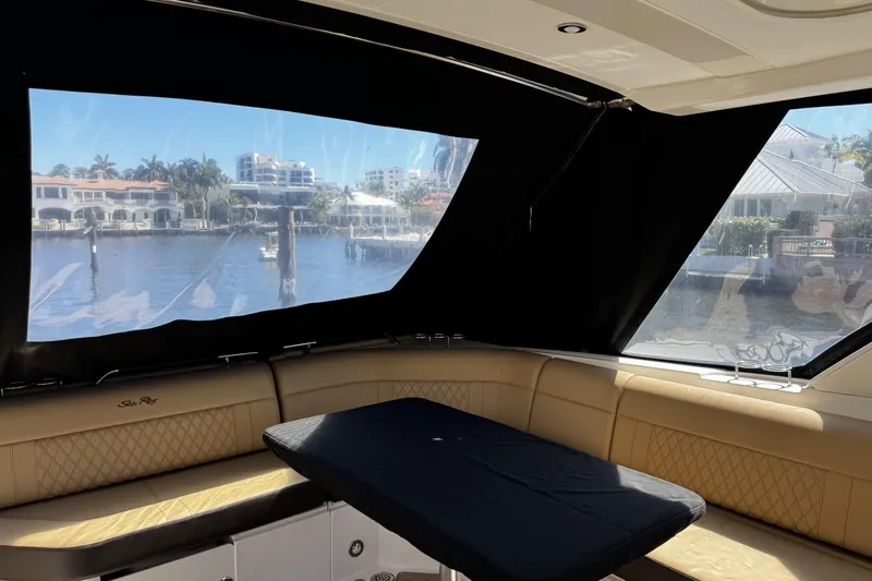Slide: The Image of Interior of 2023 Sea Ray SLX 400 yacht with waterfront view through windows. - 34