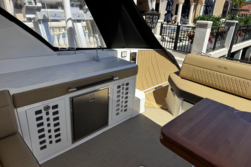 Slide: The Image of Interior of 2023 Sea Ray SLX 400 yacht with seating and kitchenette area. - 38