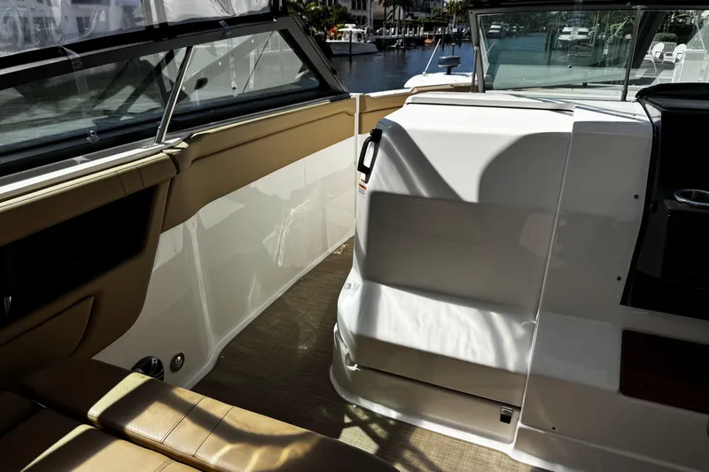 Slide: The Image of 2023 Sea Ray SLX 400 boat interior with tan seating and sleek design. - 46