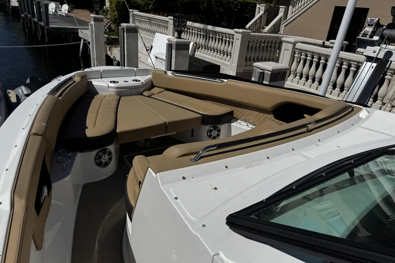 Slide: The Image of 2023 Sea Ray SLX 400 boat with luxurious seating and modern design. - 49
