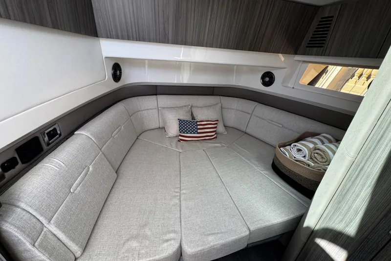 Slide: The Image of Luxurious interior cabin of 2023 Sea Ray SLX 400 yacht with cozy seating and decor. - 60