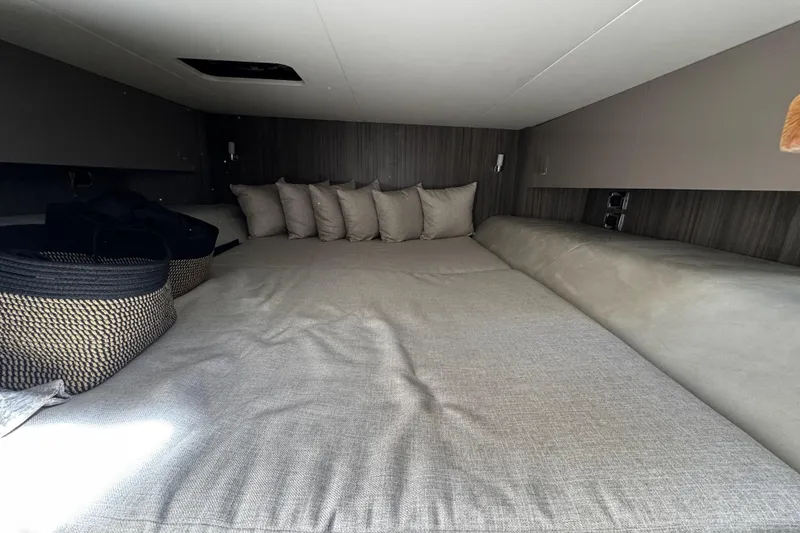Slide: The Image of Interior cabin of 2023 Sea Ray SLX 400 yacht with cozy bedding and cushions. - 61