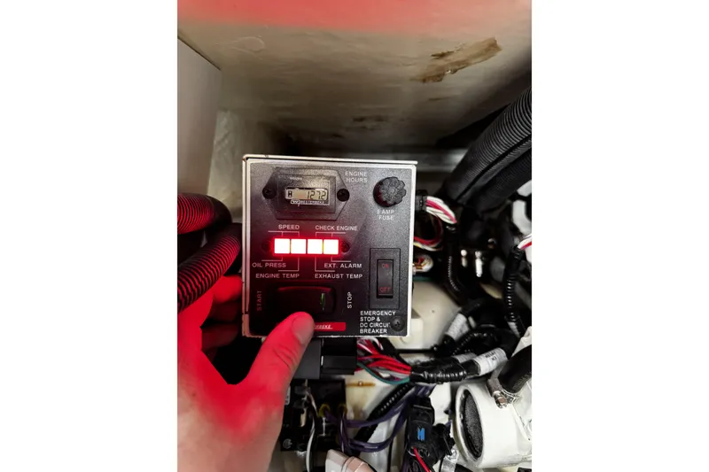 Slide: The Image of Control panel of a 2023 Sea Ray SLX 400 boat with illuminated indicators. - 68