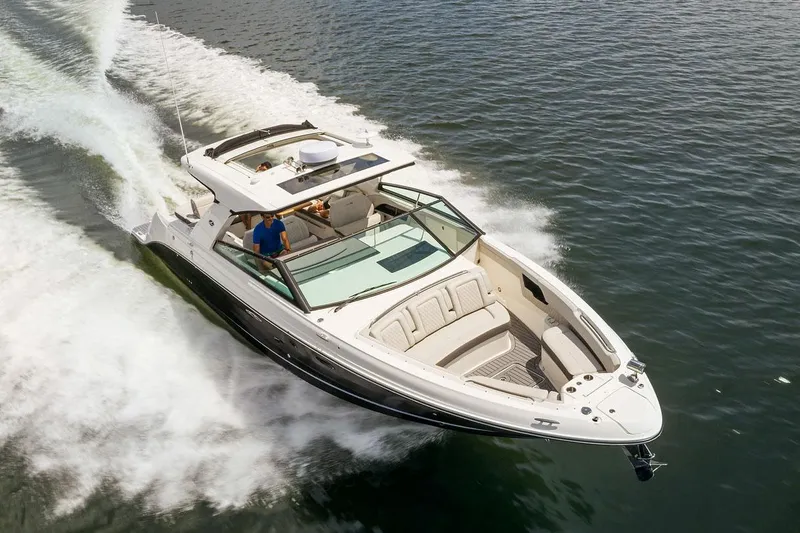 Slide: The Image of Manufacturer Provided Image: 2023 Sea Ray SLX 400 luxury motorboat cruising on water. - 7