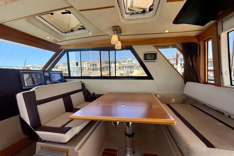 Slide: The Image of Interior of 2015 Cutwater C-30 CB boat with seating and navigation equipment. - 16