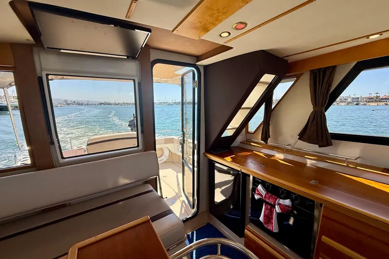Slide: The Image of Interior view of 2015 Cutwater C-30 CB boat with scenic water backdrop. - 21