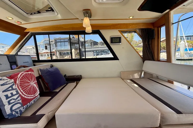 Slide: The Image of Interior of 2015 Cutwater C-30 CB boat with cozy seating and decorative pillows. - 29
