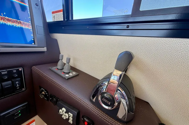 Slide: The Image of Control panel of a 2015 Cutwater C-30 CB boat with navigation equipment. - 33