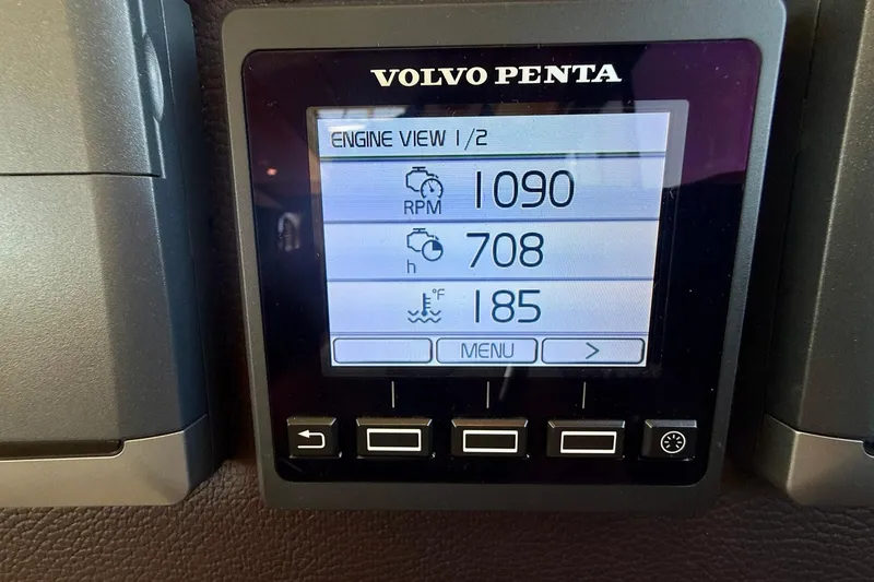 Slide: The Image of Volvo Penta engine display showing RPM, hours, and fuel data on Cutwater C-30 CB. - 34