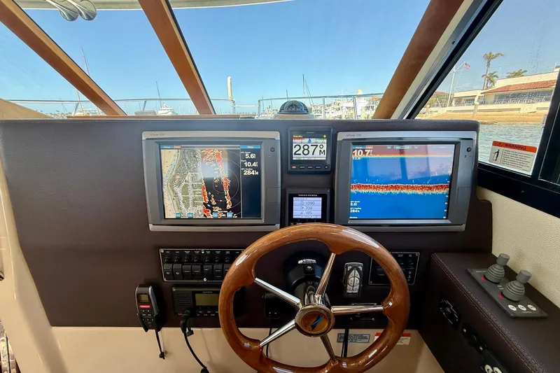 Slide: The Image of Helm of 2015 Cutwater C-30 CB with navigation screens and controls. - 35