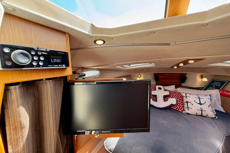 Slide: The Image of Cozy cabin interior of 2015 Cutwater C-30 CB with TV and nautical decor. - 42