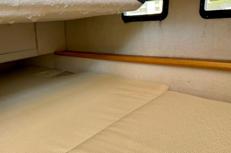 Slide: The Image of Cozy cabin interior of 2015 Cutwater C-30 CB boat with cushioned sleeping area. - 46