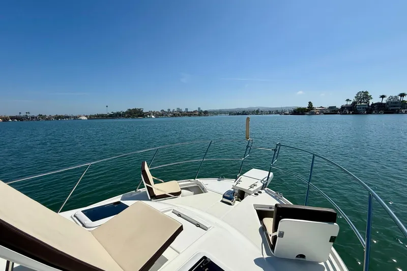 Slide: The Image of Bow view of 2015 Cutwater C-30 CB yacht on calm waters under clear blue sky. - 49