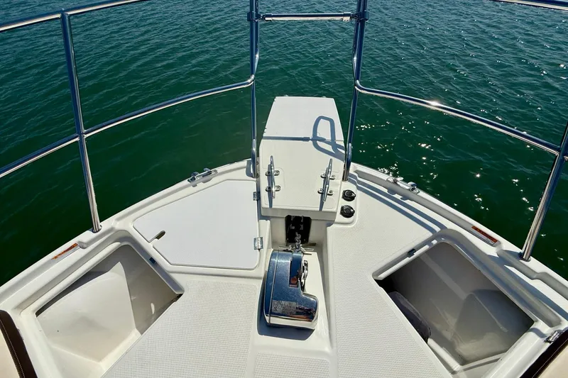 Slide: The Image of Bow of 2015 Cutwater C-30 CB boat with railing and anchor, on calm water. - 51