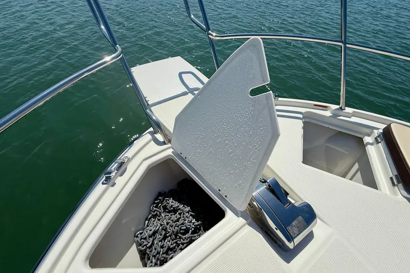 Slide: The Image of Bow of 2015 Cutwater C-30 CB boat with anchor chain storage. - 52
