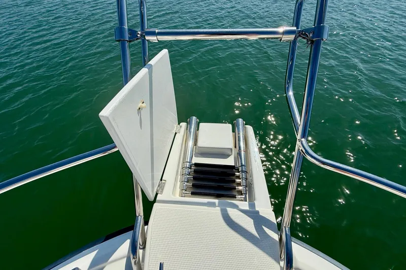Slide: The Image of Bow view of 2015 Cutwater C-30 CB boat with stainless steel railing and ladder. - 53