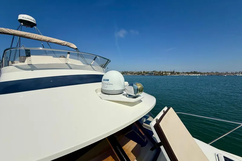 Slide: The Image of 2015 Cutwater C-30 CB yacht on calm water with clear blue sky. - 54