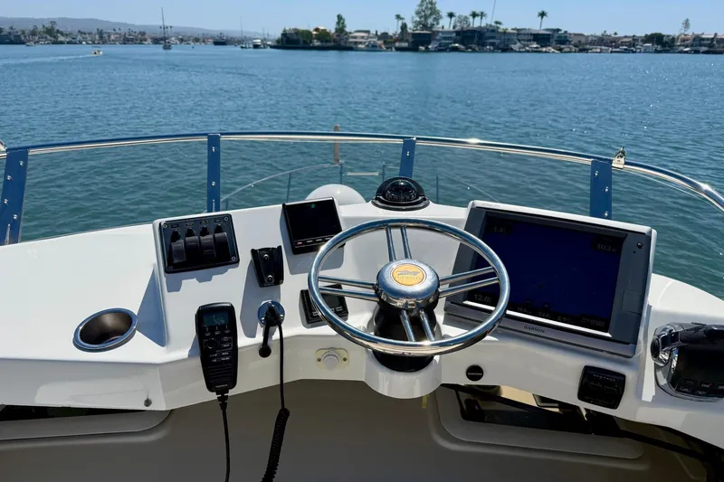 Slide: The Image of Helm of 2015 Cutwater C-30 CB boat with navigation equipment on a sunny day. - 56
