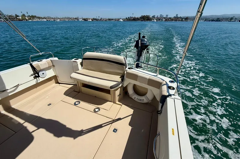 Slide: The Image of 2015 Cutwater C-30 CB boat cruising on a sunny day, featuring spacious deck and Yamaha motor. - 59