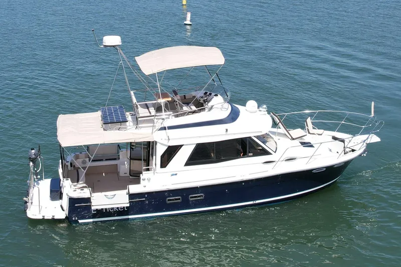 Slide: The Image of 2015 Cutwater C-30 CB boat cruising on calm blue water. - 6