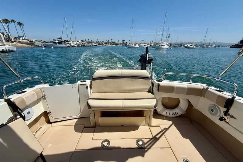 Slide: The Image of 2015 Cutwater C-30 CB boat cruising in a marina with clear blue skies. - 61