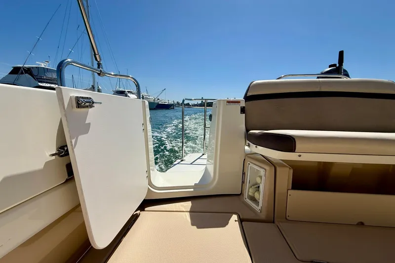 Slide: The Image of 2015 Cutwater C-30 CB boat interior with open door, sunny day, ocean view. - 65