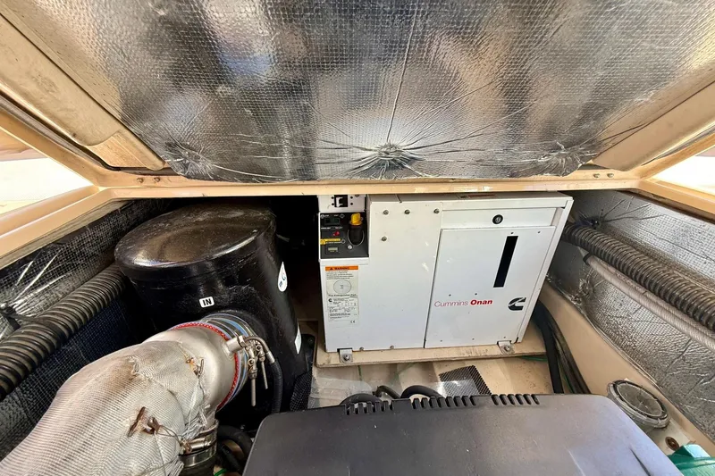 Slide: The Image of Engine compartment of a 2015 Cutwater C-30 CB with Cummins Onan generator. - 68