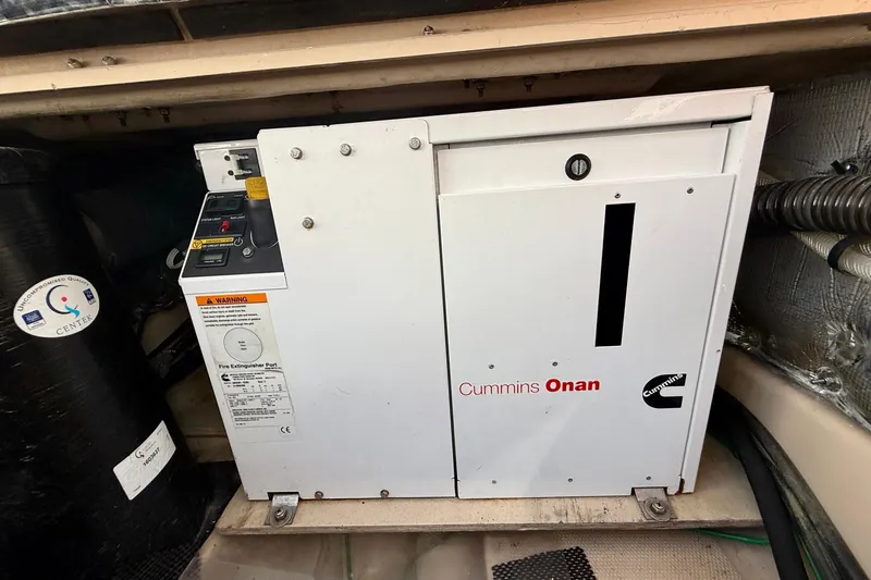 Slide: The Image of Cummins Onan generator in a 2015 Cutwater C-30 CB boat engine compartment. - 72
