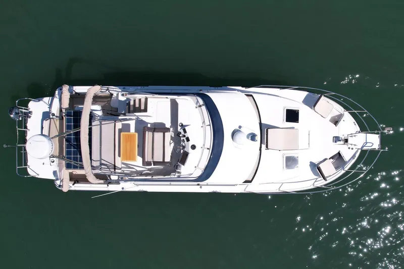 Slide: The Image of Aerial view of 2015 Cutwater C-30 CB boat on calm water. - 8