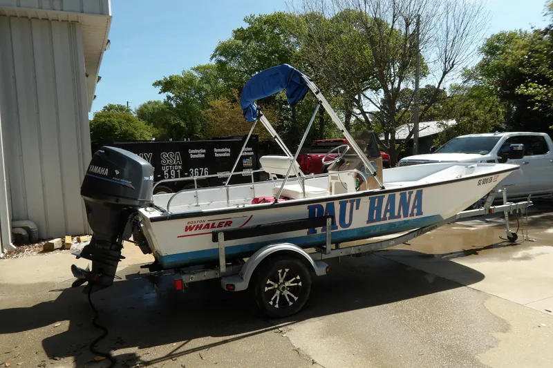 Slide: The Image of 1982 Boston Whaler Montauk 17 CC boat on trailer, featuring Yamaha outboard motor. - 10