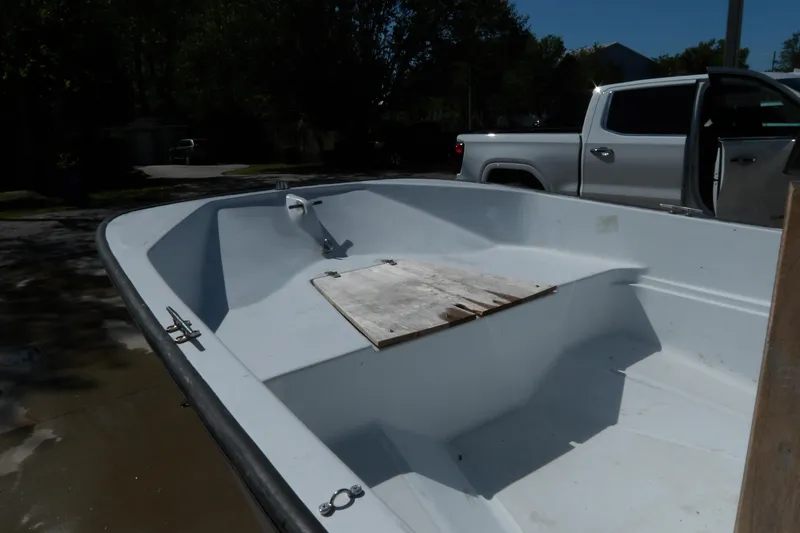 Slide: The Image of 1982 Boston Whaler Montauk 17 CC boat interior, showing open deck and seating area. - 6