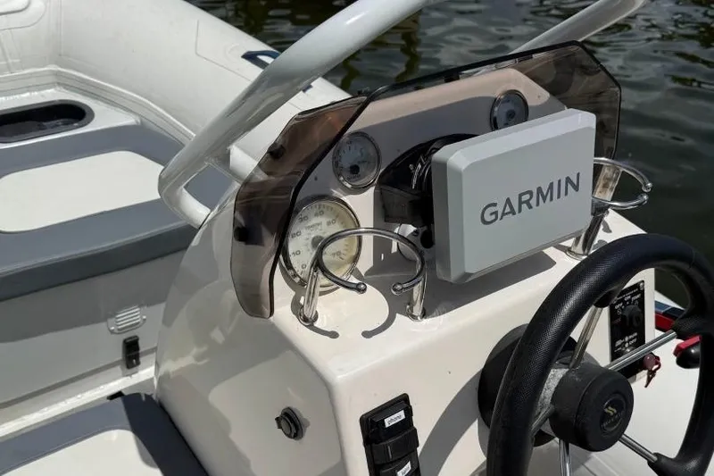 Slide: The Image of 2019 Highfield Sport 330 boat dashboard with Garmin navigation system. - 3
