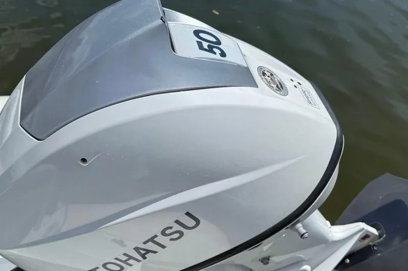 Slide: The Image of Outboard motor on a 2019 Highfield Sport 330 boat, labeled "Tohatsu 50." - 5