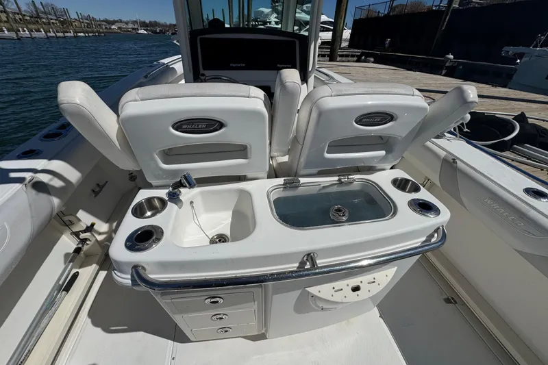 Slide: The Image of 2014 Boston Whaler 280 Outrage boat interior with seating and fishing station. - 10