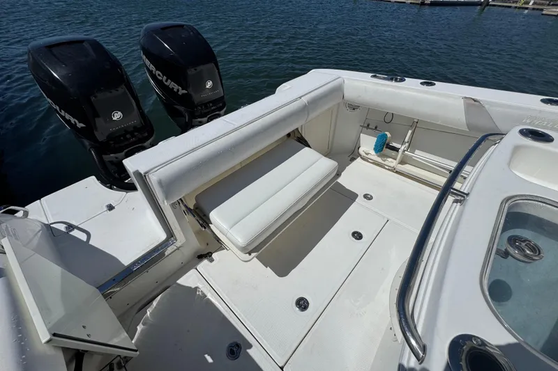 Slide: The Image of 2014 Boston Whaler 280 Outrage boat with dual Mercury engines and spacious seating area. - 11