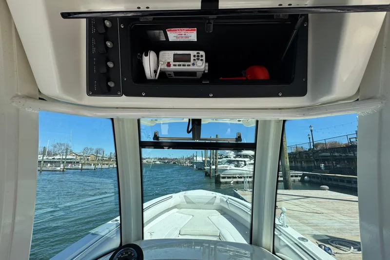 Slide: The Image of Interior view of a 2014 Boston Whaler 280 Outrage boat at a marina. - 7