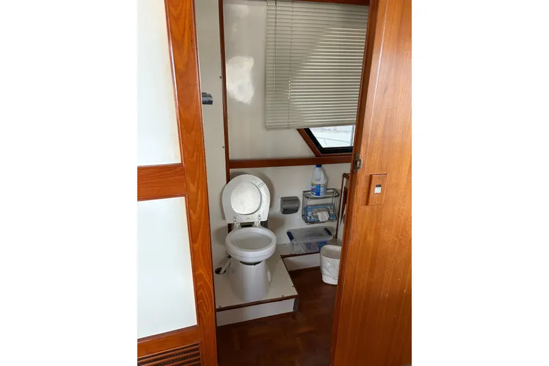 Slide: The Image of Bathroom interior of 1989 Jefferson 60' Marquessa Motor Yacht with wooden accents. - 26