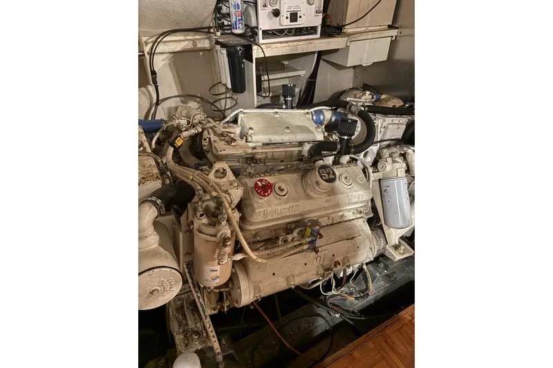 Slide: The Image of Engine room of a 1989 Jefferson 60' Marquessa Motor Yacht, showcasing detailed machinery. - 7