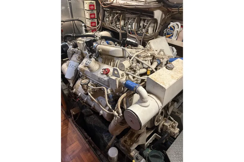 Slide: The Image of Engine room of a 1989 Jefferson 60' Marquessa Motor Yacht, showcasing complex machinery. - 8