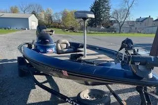 Slide: The Image of 2001 Nitro 700 LX SC boat on trailer in sunny outdoor setting. - 4