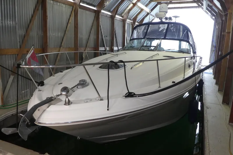 The Image of 2005 Sea Ray 340 Sundancer yacht docked in a covered marina. - 0