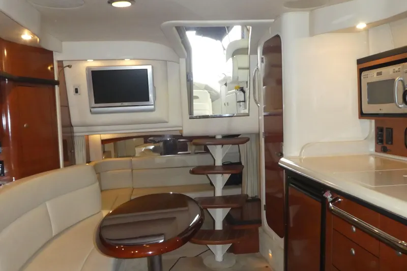 Slide: The Image of Interior of a 2005 Sea Ray 340 Sundancer yacht with modern amenities and elegant design. - 10
