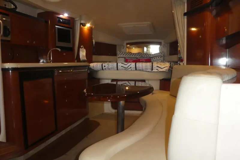 Slide: The Image of Luxurious interior of a 2005 Sea Ray 340 Sundancer yacht with elegant wood finishes. - 12