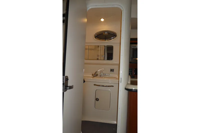 Slide: The Image of Interior view of 2005 Sea Ray 340 Sundancer bathroom with sink and mirror. - 19