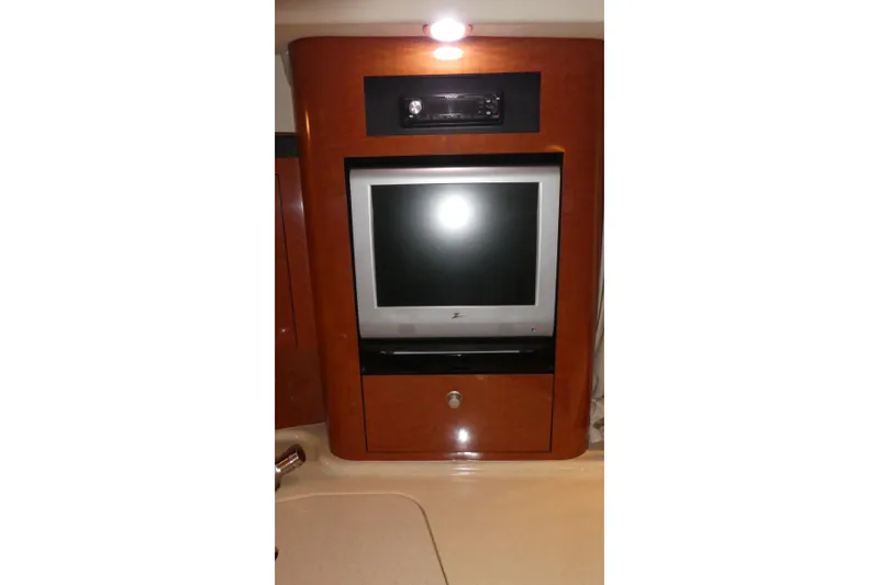 Slide: The Image of 2005 Sea Ray 340 Sundancer interior with built-in TV and audio system. - 21