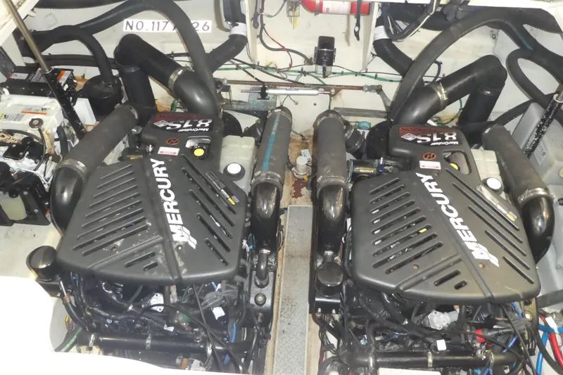 Slide: The Image of Engine room of a 2005 Sea Ray 340 Sundancer with twin Mercury engines. - 23