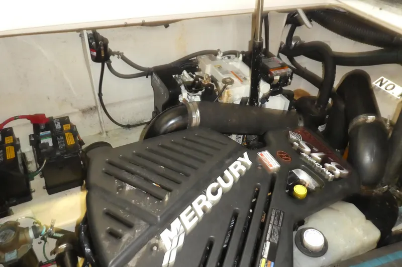 Slide: The Image of Engine compartment of a 2005 Sea Ray 340 Sundancer with Mercury components visible. - 24